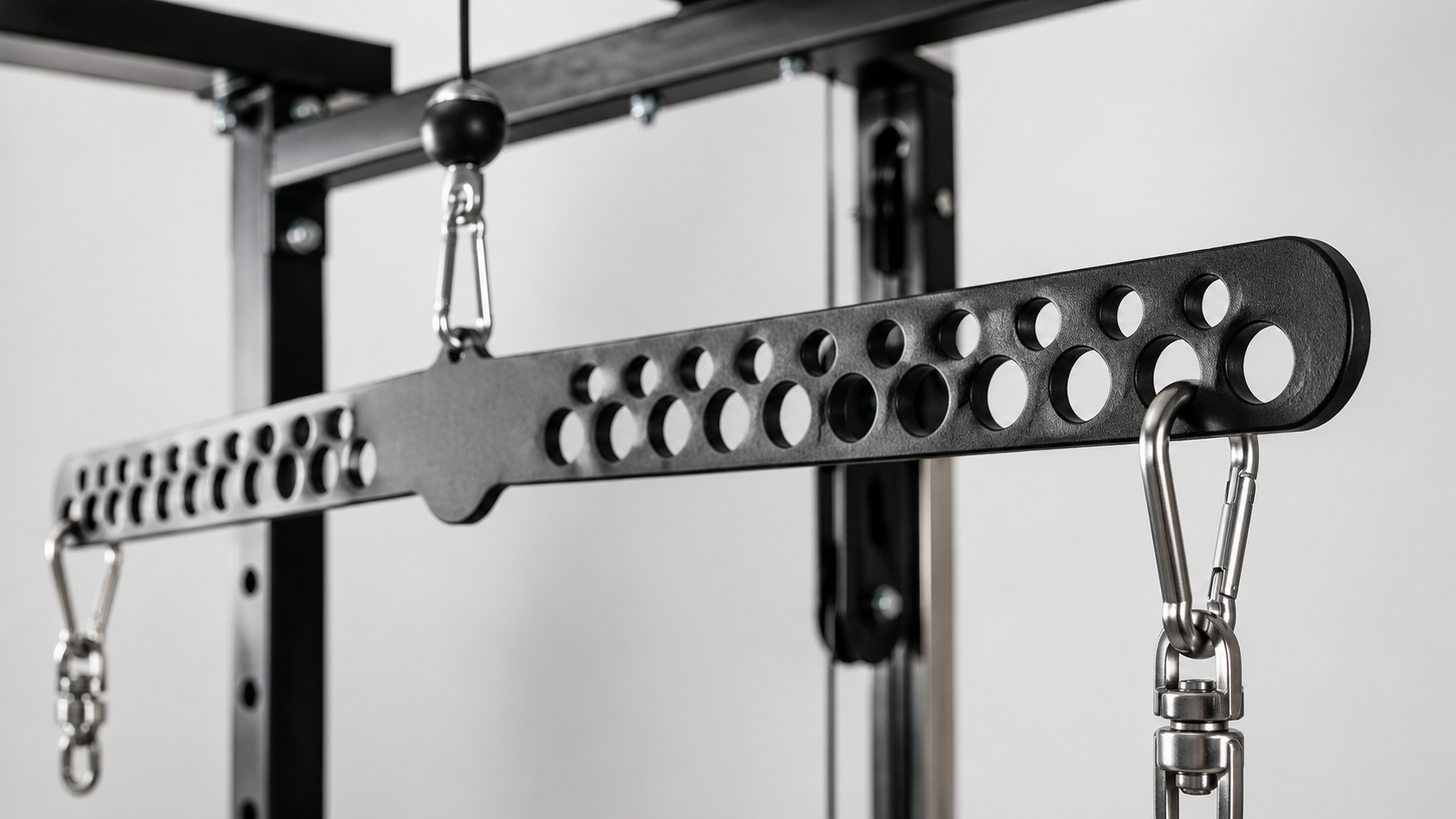 Multi-Grip LAT Pull Down Bar Review Close-up of the Multi-Grip LAT Pull Down Bar showing steel finish and swivel bearing